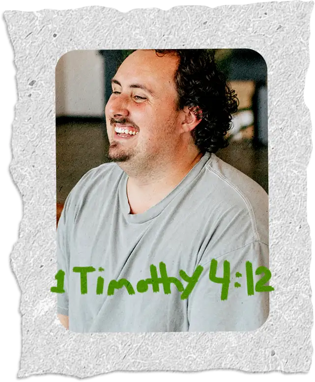 A student leader laughing, with 1 Timothy 4:12 written across the photo